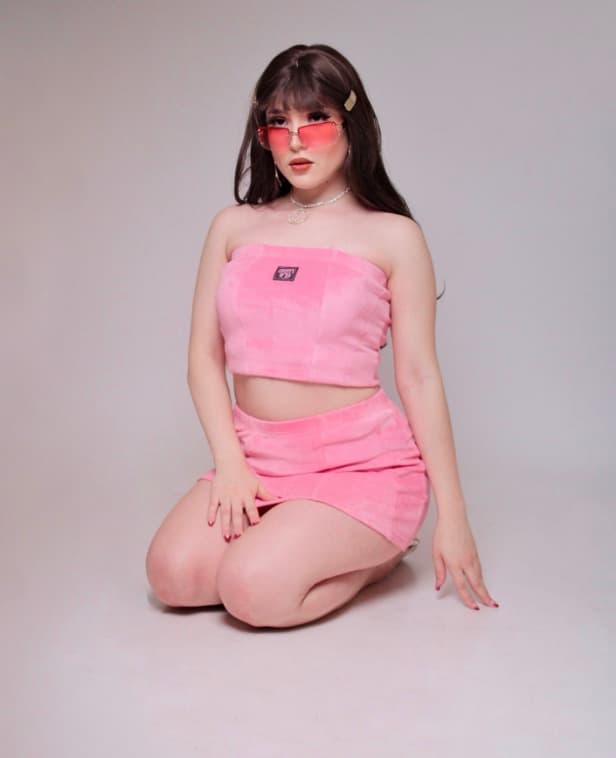 hacko in a pink velour set